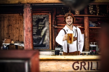 Bavarian man and his own small business. Grill bar interior. 