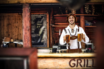Bavarian man and his own small business. Grill bar interior. 
