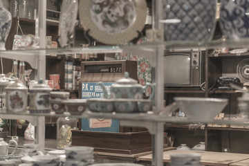 Vintage store front with 60's cash register in focus