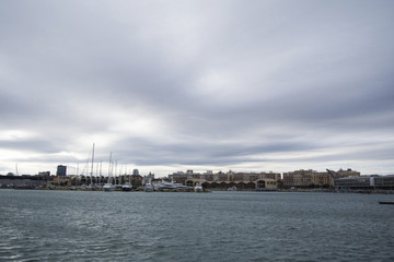 Luxury Yachts And Boats In Valencia Port At Mediterranean Sea. Reflexion in the water. White yachts...