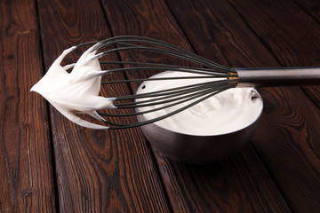 close up of a white whipped or sour cream in bowl