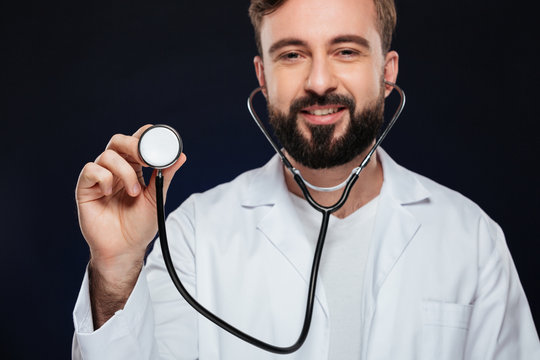 Cropped image of a happy male doctor dressed in uniform