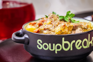 Pork stew served with cooked potatoes