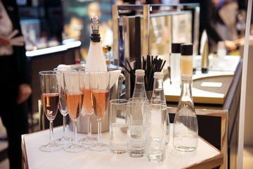 Alcohol bar, cocktail glass on bar counter, cocktail glass in a bar, Drinking cocktail in bar, cocktail in the glass with straws, Fresh drink coctail on a color background