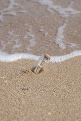 message in a bottle on beach