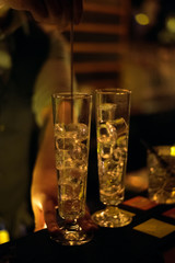 Alcohol bar, cocktail glass on bar counter, cocktail glass in a bar, Drinking cocktail in bar, cocktail in the glass with straws, Fresh drink coctail on a color background