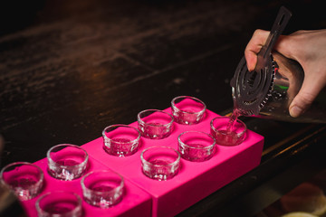 Alcohol bar, cocktail glass on bar counter, cocktail glass in a bar, Drinking cocktail in bar, cocktail in the glass with straws, Fresh drink coctail on a color background