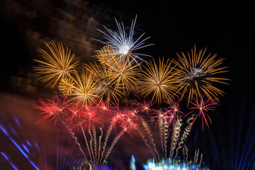 Colourful fireworks in the night of celebration.