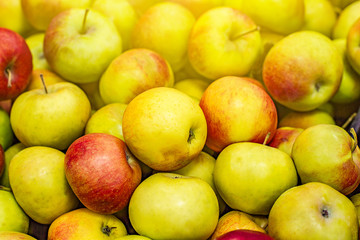 Many apples on the store counter, fruit vitamins