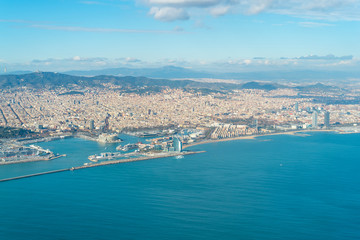 Naklejka premium Aerial view of the city of Barcelona. In the aircraft above the city, shortly before landing