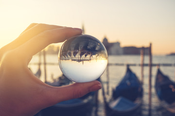 Venice gondola view through crystal glass ball