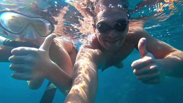 father and daughter and snorkeling