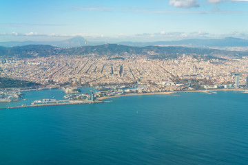 Naklejka premium Aerial view of the city of Barcelona. In the aircraft above the city, shortly before landing