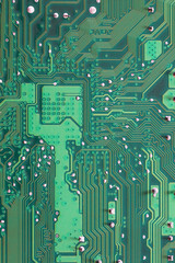 Green Computer motherboard surface of technology background.
