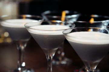 Alcohol bar, cocktail glass on bar counter, cocktail glass in a bar, Drinking cocktail in bar, cocktail in the glass with straws, Fresh drink coctail on a color background