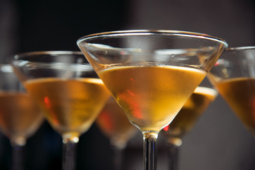 Alcohol bar, cocktail glass on bar counter, cocktail glass in a bar, Drinking cocktail in bar, cocktail in the glass with straws, Fresh drink coctail on a color background