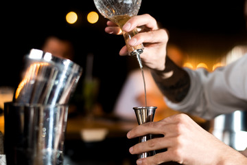 Alcohol bar, cocktail glass on bar counter, cocktail glass in a bar, Drinking cocktail in bar, cocktail in the glass with straws, Fresh drink coctail on a color background