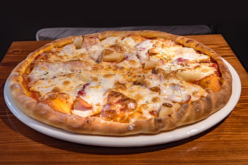 Hot delicious pizza freshly cooked in a cafe