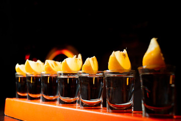 Alcohol bar, cocktail glass on bar counter, cocktail glass in a bar, Drinking cocktail in bar, cocktail in the glass with straws, Fresh drink coctail on a color background