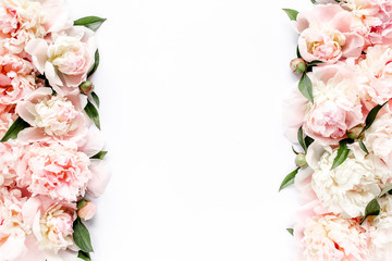 Flower border frame made of pink and beige buds peony bouquet on a white background. The apartment lay, top view. Floral texture background. - obrazy, fototapety, plakaty