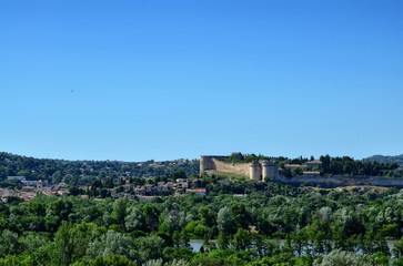 Fototapeta na wymiar June 23, 2016 6:00 pm Avignon, Provence, France. View from the hill of the city from towards Chateau De Villeneuve Les Avignon over the Rhone.