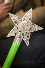 Plastic magic wand for kids with star on top.