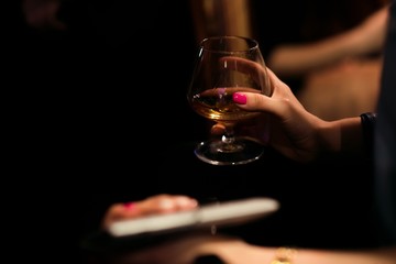Alcohol bar, cocktail glass on bar counter, cocktail glass in a bar, Drinking cocktail in bar, cocktail in the glass with straws, Fresh drink coctail on a color background