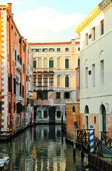 Fototapeta na wymiar A quiet, empty canal in Venice, Italy