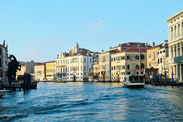 Boats along the Grand Canal of Venice in daylight.