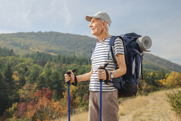 Fototapeta na wymiar Elderly hiker looking away outdoors