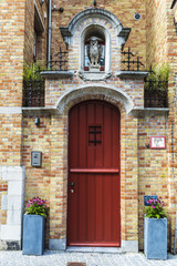 Fototapeta na wymiar Facade of an old classic building in Bruges, Belgium