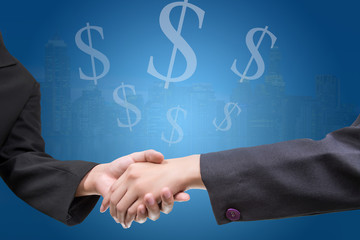 business people shaking hands outside modern office building background and us dollars. concept for business and success.