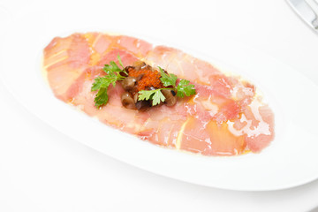 Salmon carpaccio with rocket salad