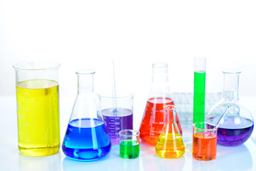Laboratory glassware with colorful chemical reagent in research laboratory 
