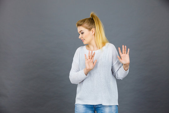 Woman deny something showing stop gesture with hands
