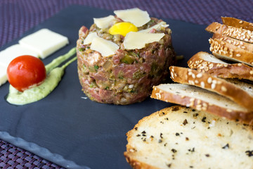 tasty Steak tartare (Raw beef) - classic steak tartare on white plate