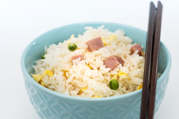 Homemade Chinese fried rice with vegetables and fried eggs