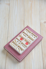 Wooden block calendar show date, month and year with Two Red hearts.