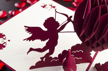 image of the valentine's angels on the table and heart
