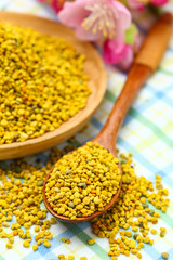 Bee pollen in wooden plate and spoon