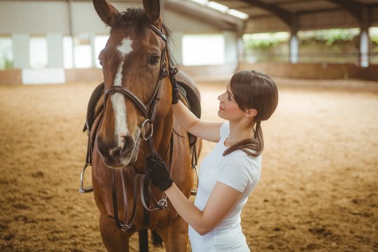 Woman standing with her horse