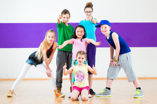 Children in zumba class dancing modern group choreography 