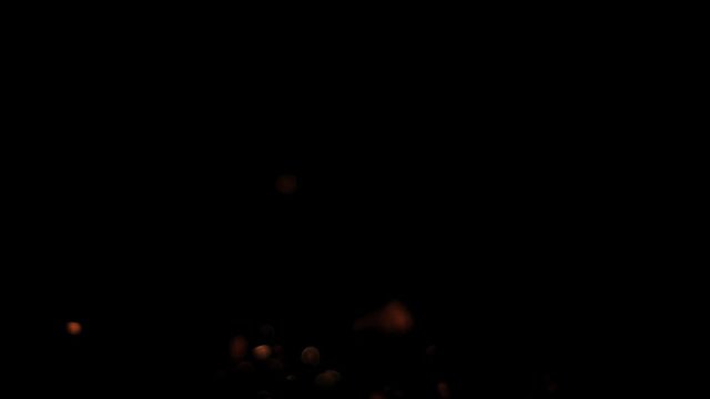 Fire sparks from campfire over black background - Slow Motion - PNG+Alpha