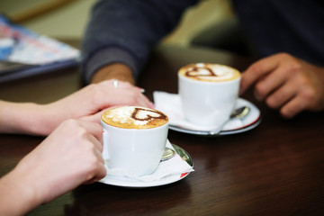 man and woman hands. love and cup coffee concept
