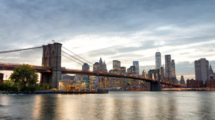 Manhattan skyline and Brooklyn Bridge view from Brooklyn Bridge Park at sunset, New York City