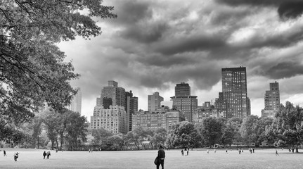 NEW YORK CITY - OCTOBER 25, 2015: Central Park in Autumn with tourists. The city attracts 50...