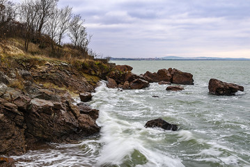 Rocky coastline and the winter beach