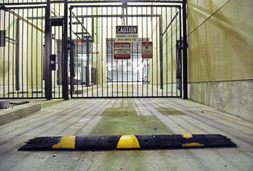 Secure parking garage with speed bump