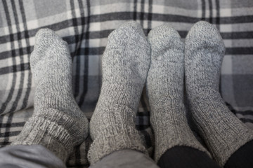 Feet in woollen socks