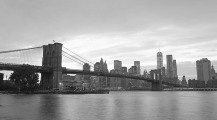 Fototapeta na wymiar NEW YORK CITY - OCTOBER 25, 2015: Downtown Manhattan from Brooklyn Bridge Park. The city attracts 50 million people every year